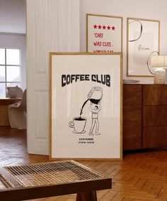 there is a coffee club poster on the wall next to a wooden table and chair