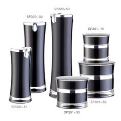 three different sizes of black and silver vases with the same size as each one