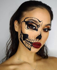 a woman with makeup painted to look like a skeleton face paint on her face and lips