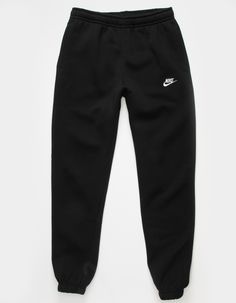 Nike Sportswear Club Fleece Sweatpants. Combines classic style with the soft comfort of fleece. Standard fit has a relaxed, easy feel. Tapered leg. Elastic waistband. Side pockets. Embroidered logo on left leg. Elastic cuffs. Fleece lining. 80% Cotton 20% Polyester. Machine wash. Imported. Nike For Women Clothes, Nike Oversized Sweatpants, Joggings Nike, Nike Wishlist, Tuta Nike, Nike Trackies, Nike Trousers, Black Nike Pants, Nike Hose