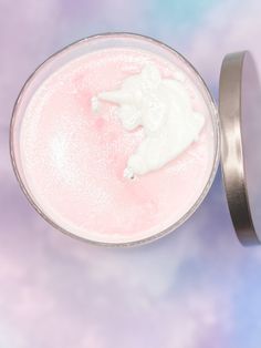 a close up of a drink in a glass on a purple and blue tablecloth