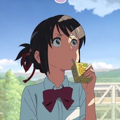 an anime character holding a cell phone to her ear and looking up at the sky