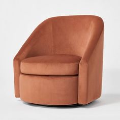 an orange swivel chair on a white background