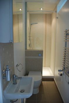 a bathroom with a sink, toilet and bathtub