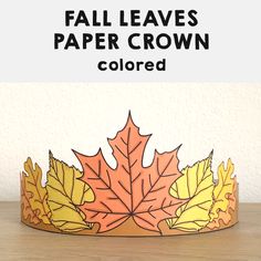 a paper crown with leaves on it and the text fall leaves paper crown colored above