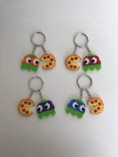 four key chains with different designs on them