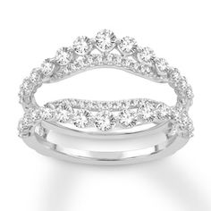 a white gold wedding ring set with round diamonds