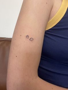 a woman with a small tattoo on her arm