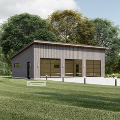 a two car garage sitting on top of a lush green field