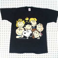 a black t - shirt with cartoon characters on it