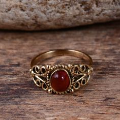 "Red Onyx Ring, Gold Ring, Gemstone Ring, Statement Ring for Women, Handmade Ring, Brass Ring, Designer Ring, Promise Ring, Boho Ring Size:- All Size Available In Variation Metal:- Brass Stone:- Red Onyx 1 product free gift on purchase of 3 products. You can choose the plain brass ring free gift as your wish. Take a screenshot of plain brass ring you like from my shop and send me a photo in personal message. MUST READ....👇 5 stars is my shop's priority. So contact me before leaving any negative Spiritual Ruby Rings In Red, Spiritual Red Ruby Rings, Red Gemstone Toe Ring, Vintage Red Crystal Gemstone Ring, Handmade Red Toe Ring, Red Oval Bohemian Rings, Bohemian Red Gemstone Rings, Spiritual Red Promise Ring, Bohemian Red Anniversary Rings