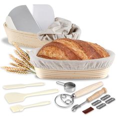 a loaf of bread sitting on top of a table next to kitchen utensils