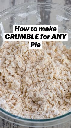 a glass bowl filled with oatmeal sitting on top of a wooden table