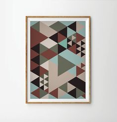 an abstract painting hangs on the wall in front of a white wall with a wooden frame