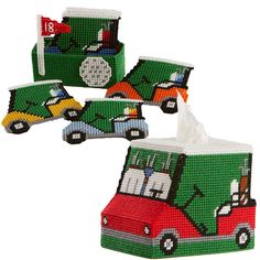 four green and red tissue boxes with cars on them, one is filled with tissues