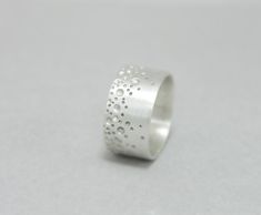 Bubble wide band ring sterling silver, dots, unisex, men ring I make this ring from 1mm (1/32 inch) sterling silver sheet, engraved it with a random pattern and brushed it. Each ring is individually made, so there won't be two rings exactly the same. This ring is 10 mm wide. If the size you prefer is not available, please contact me. Each ring is handmade to order and may slightly vary from the pictures. Please allow for subtle variations making each handmade piece unique. ----> All Internati Stacking Rings Ideas, Silver Casting, Bubble Ring, Random Pattern, Wide Band Ring, How To Make Rings, Men Ring, Wide Band Rings, Silver Jewelry Handmade