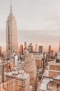 an aerial view of the empire building in new york city, ny at sunset or dawn