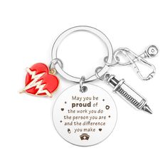 a keychain with a heart and an arrow on it that says, may you be proud of the work you do