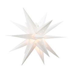 a white christmas star with lights hanging from it's side on a white background