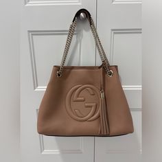 Authentic Gucci Soho Chain Shoulder Bag. Absolutely Stunning! Pristine Condition. Saddle Color. Did Not End Up Using. Comes With Dust Bag And Card Inserts. Not A Mark On This Bag, Inside Is Clean. Chain Can Be Worn Double Chain Or Single. Can Send More Pics Or Videos. Gucci Bags, Double Chain, Chain Shoulder Bag, Soho, Saddle, Dust Bag, Bag Lady, Gucci, Shoulder Bag