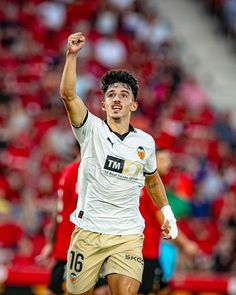 a soccer player is celebrating his team's victory