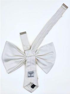 Our most elegant bow is now available in multiple sizes, with stunning hand embroidery for any big event. With hand-crafted flowers that add dimension against a supple silk backdrop, it's a truly standout accessory. Style with a strapless gown or top to highlight the stunning shape. Highlight the pink flower details with nice jewelery. Size 1: 14.5-17" neckband Size 2: 15-18.5" neckband Silk Backdrop, Crafted Flowers, Nice Jewelry, Strapless Gown, Pink Flower, The Pink, Floral Embroidery, Amazing Jewelry, Bow Tie