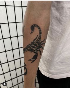 a man with a scorpion tattoo on his arm