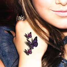 black and white photo of woman with butterfly tattoo