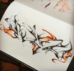 a drawing of some type of art on paper with orange and black flames coming out of it