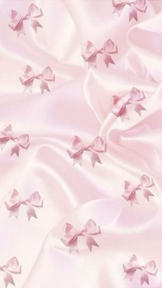 pink satin fabric with bows on it