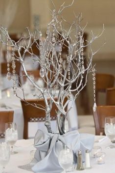 the centerpieces are decorated with beads and branches