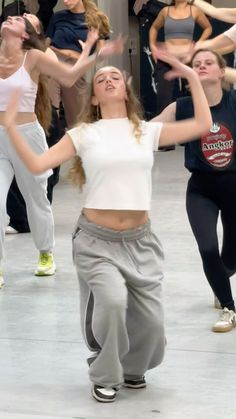 a group of young women dancing in a dance studio