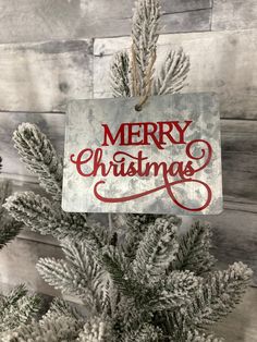 a christmas ornament hanging from the top of a tree