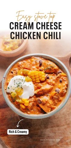 a bowl of chicken chili with sour cream on top