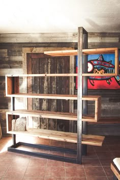 a wooden shelf sitting in the corner of a room