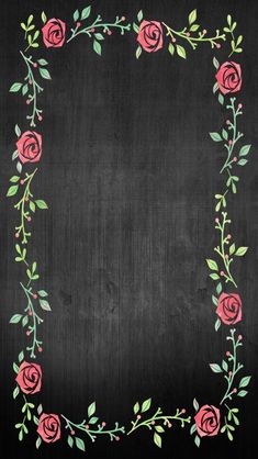 a blackboard with pink roses and green leaves in the center, on top of it