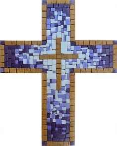 a cross made out of blue and brown bricks