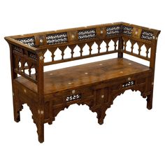 a wooden bench with intricate carvings on it