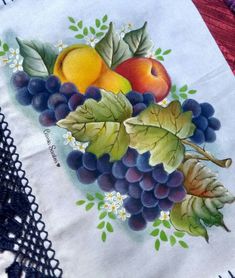 a table cloth with fruit painted on it