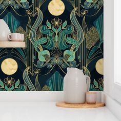 the wallpaper in this kitchen is designed to look like an art deco design with gold and green accents