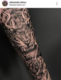 a tiger tattoo on the arm with roses around it and an arrow in the middle