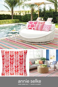 an outdoor living room with red, white and pink pillows on the floor next to a pool