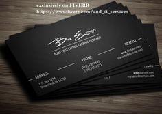 five black business cards sitting on top of a wooden table