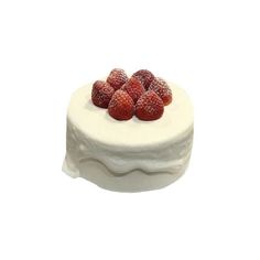 a white cake topped with fresh strawberries on top of it's icing