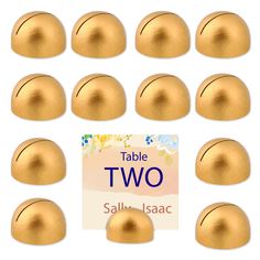 twelve gold balls with labels on them for table two, salli iscac