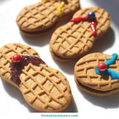 four cookies decorated to look like flip flops