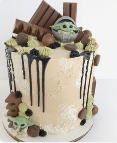 a star wars themed cake with chocolate and marshmallows on the icing