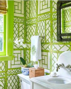 the bathroom is decorated in green and white