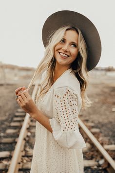 a woman wearing a hat and smiling at the camera with an instagram message below