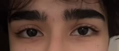 a close up of a person's eyes and eyebrows